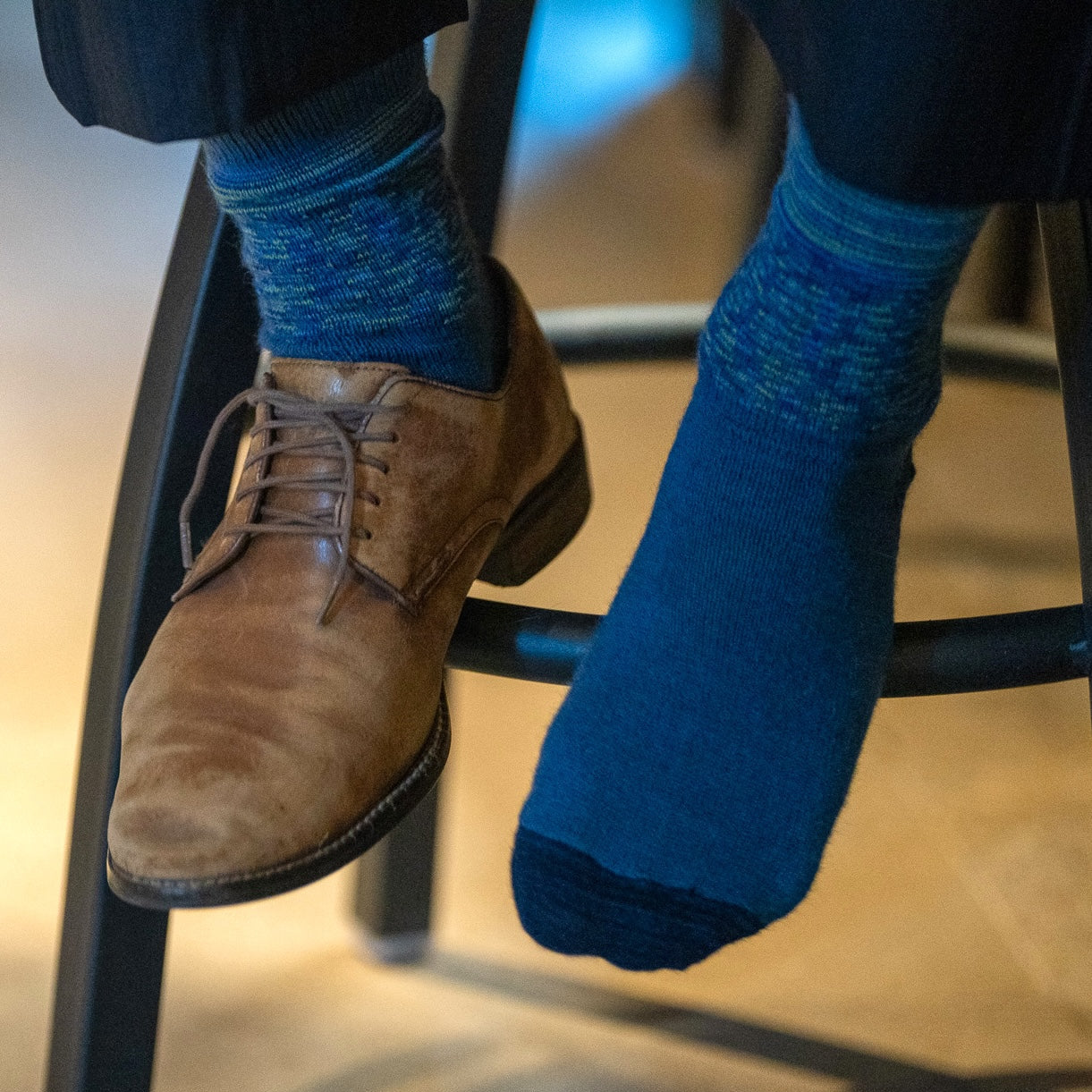 Alpaca Sock Shop blue crew sock one shoe on