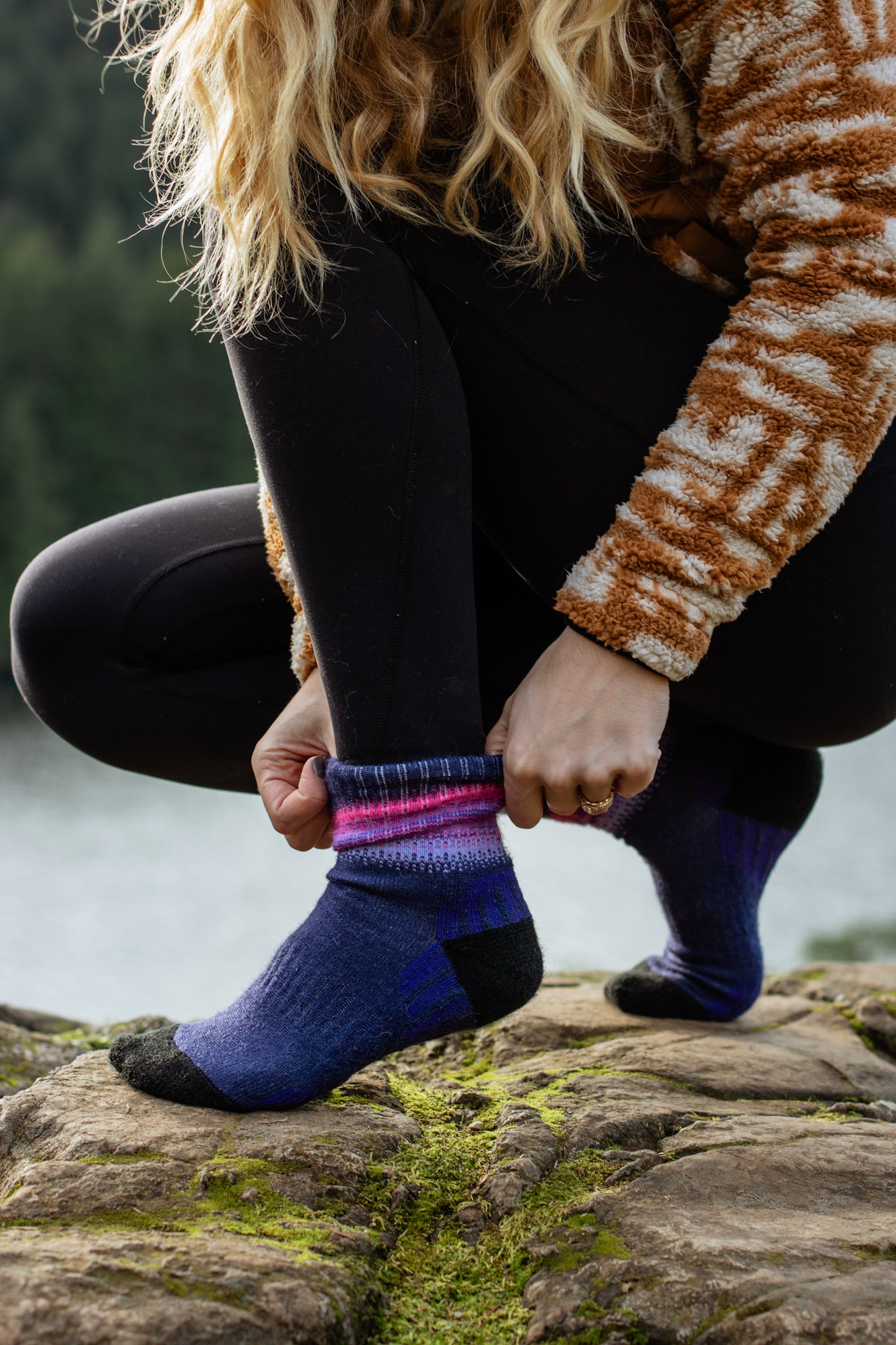 Alpaca Sock Shop purple hiking socks mountains putting socks on