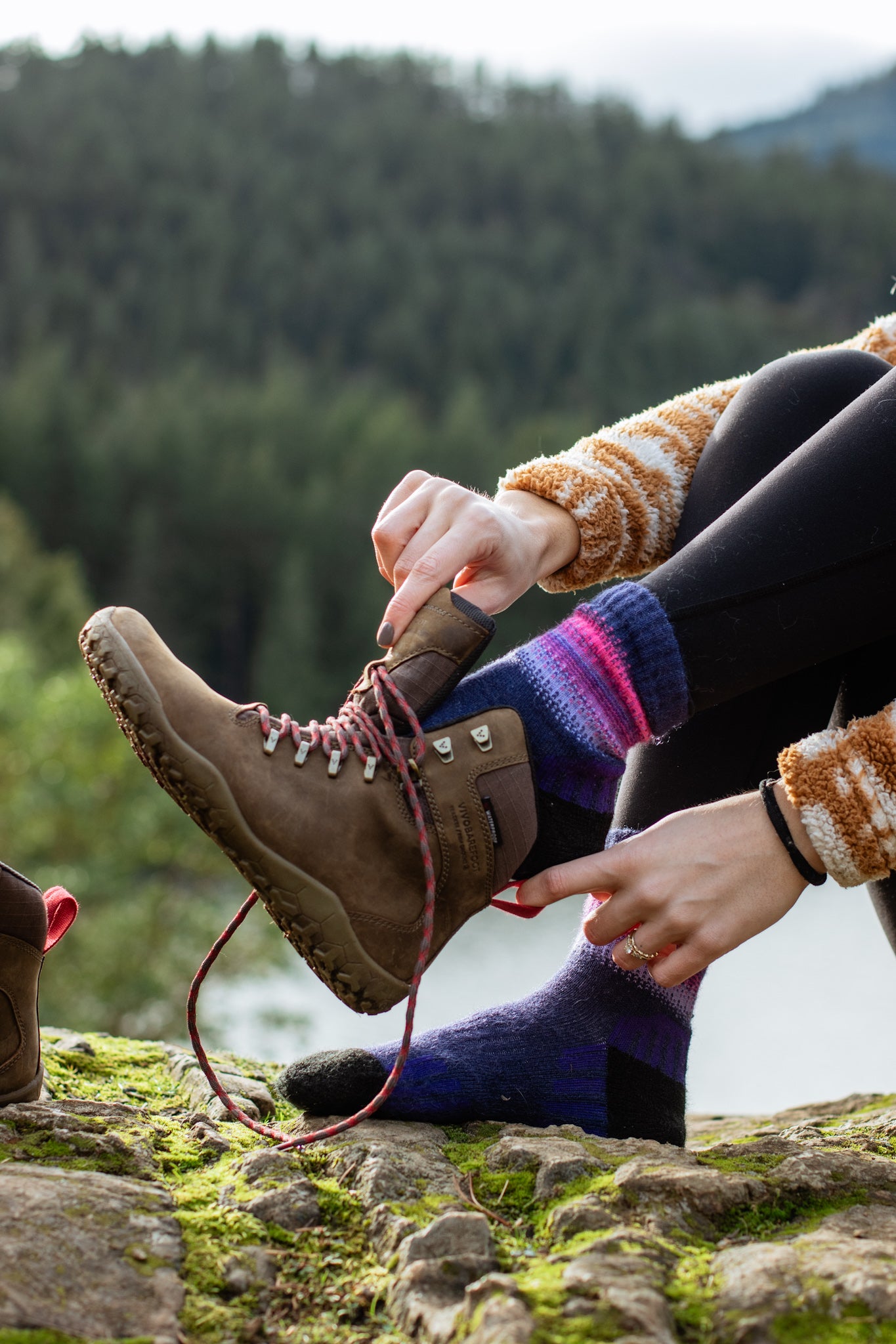 Alpaca Sock Shop purple hiking socks mountains putting shoes on
