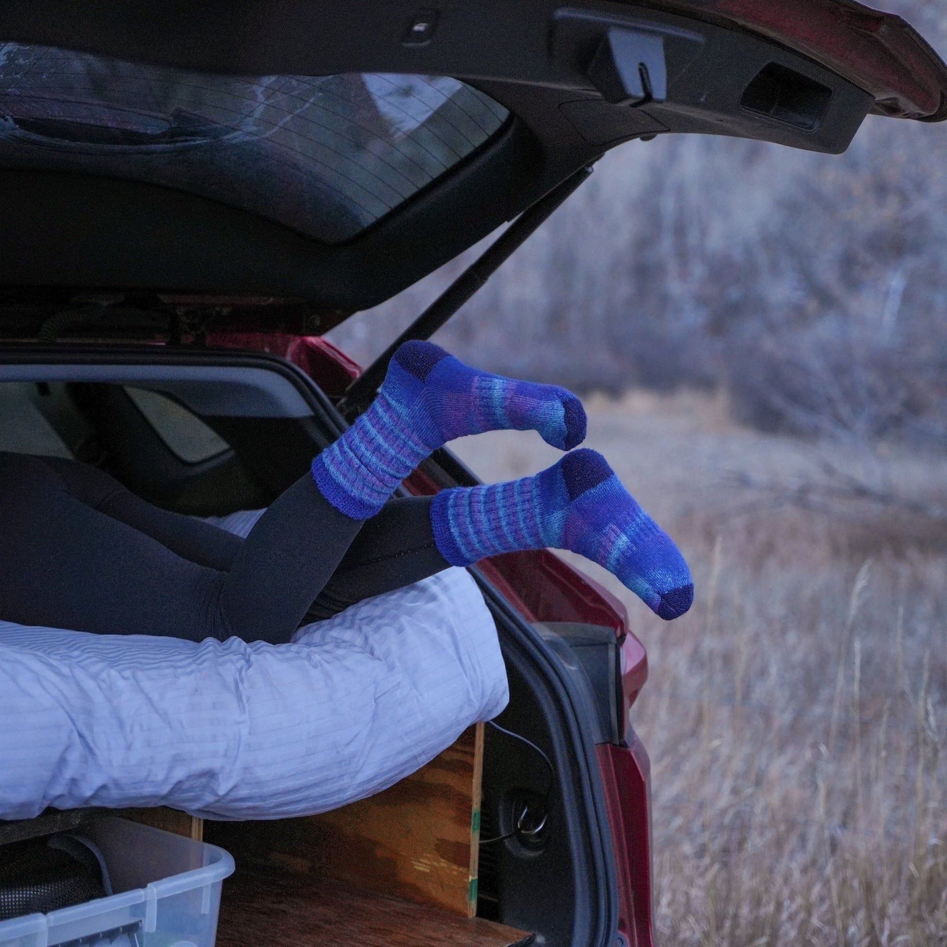 Car trunk with blue socks on a natural background